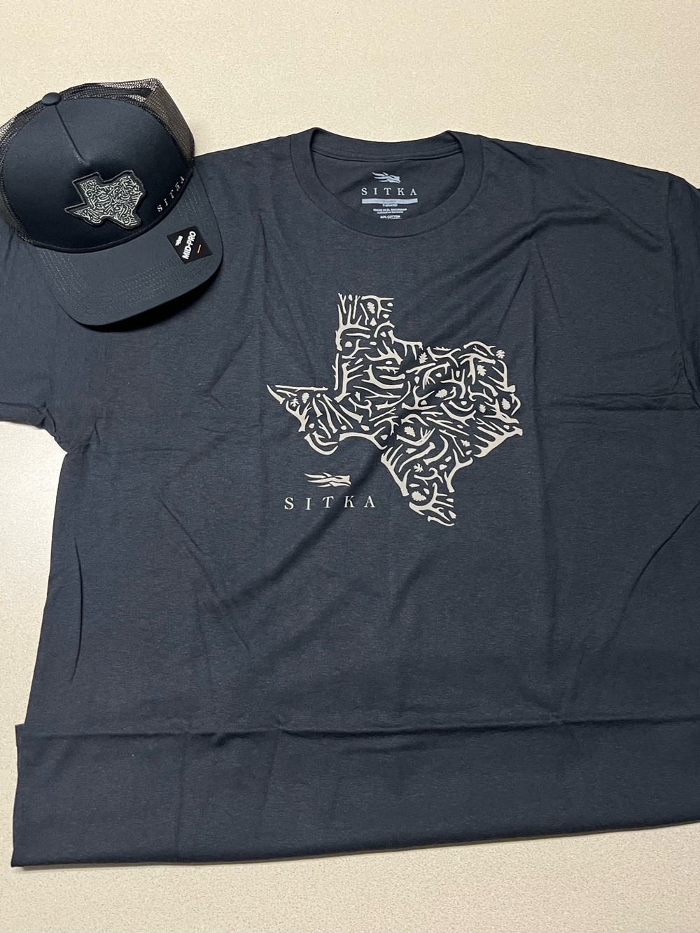 Men’s Sitka Black Graphic Tee - Texas Outline and Trucker hat